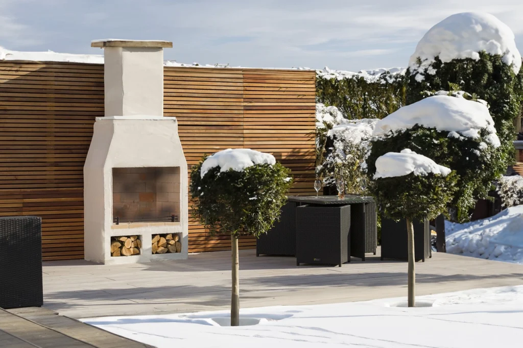 Heated patio with a fireplace in winter